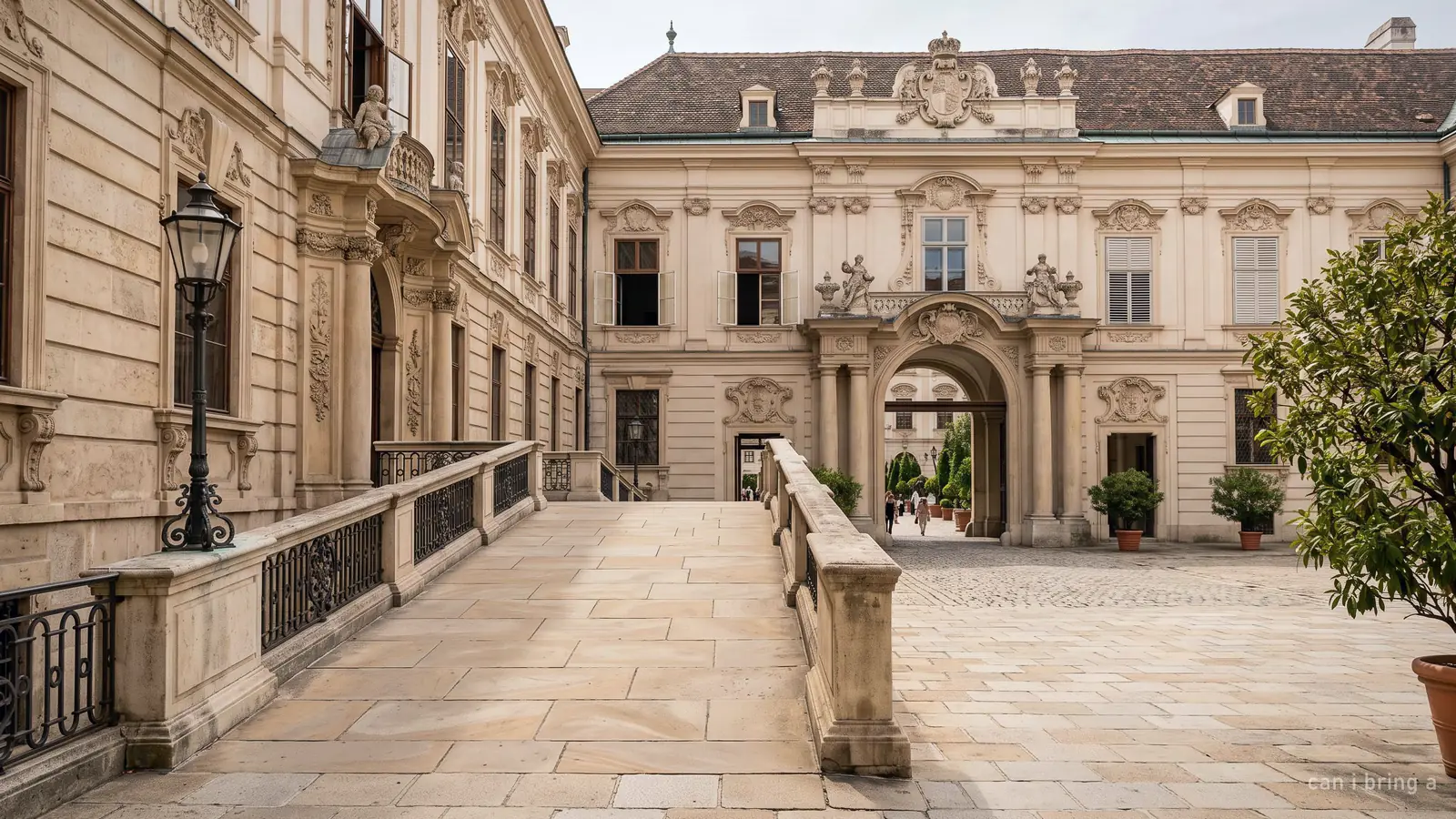 A step-free stone ramp into a historic Viennese palace courtyard