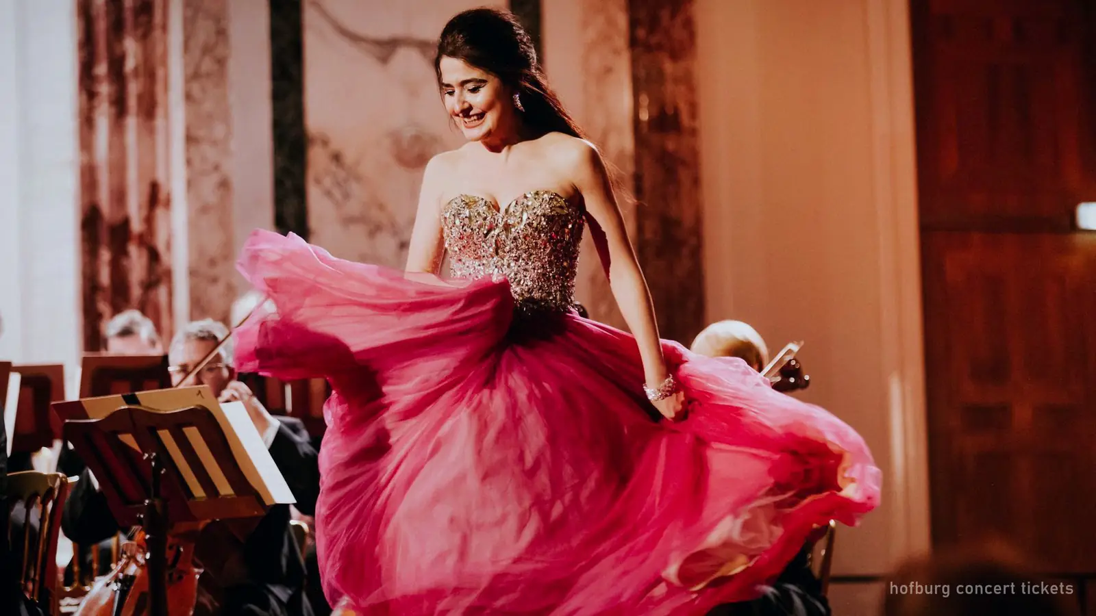 A soprano performing in an evening gown at a Hofburg concert, Vienna — photo from the booking listing