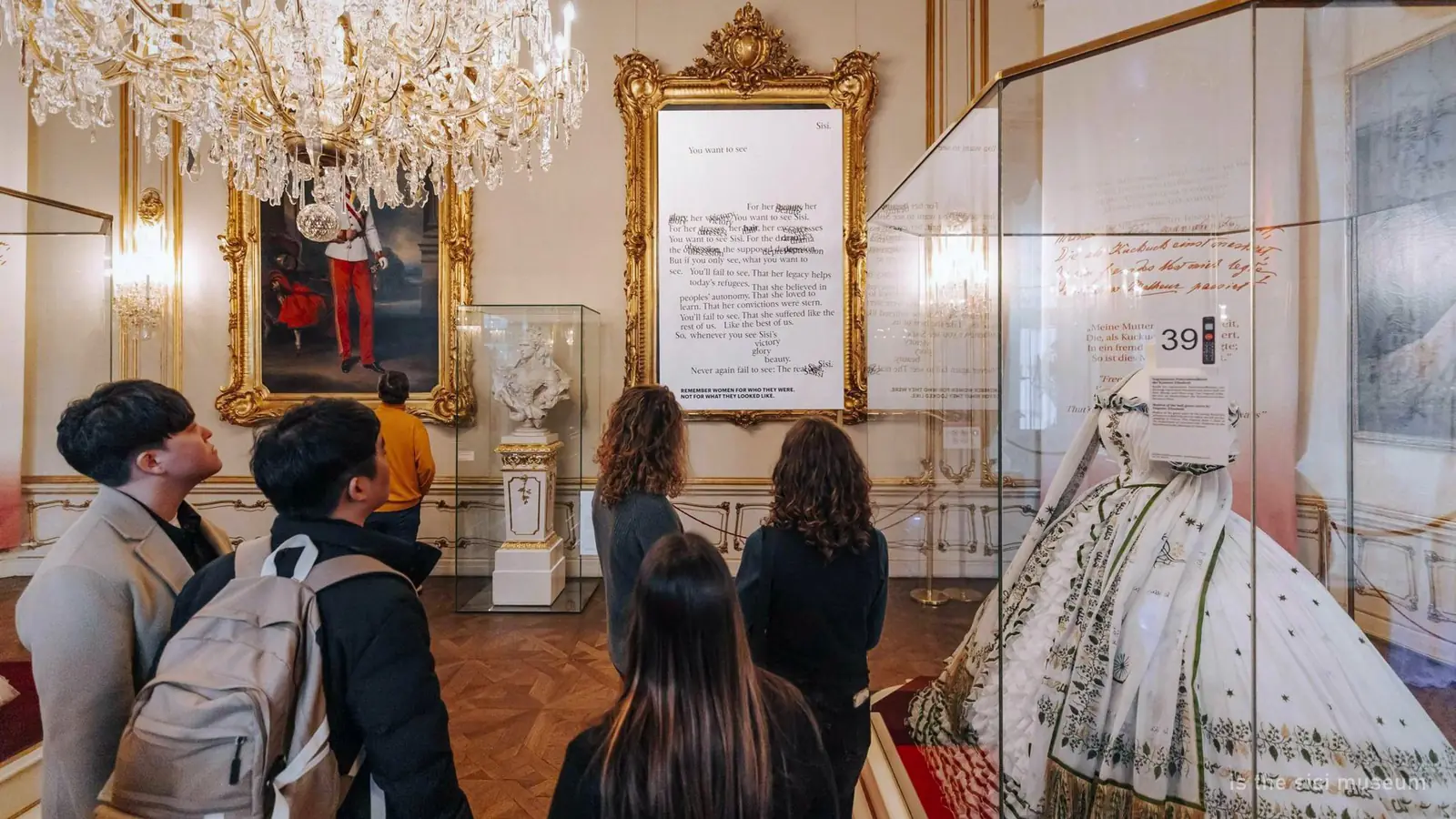 Visitors looking at exhibits in the Sisi Museum at the Hofburg, Vienna — photo from the booking listing