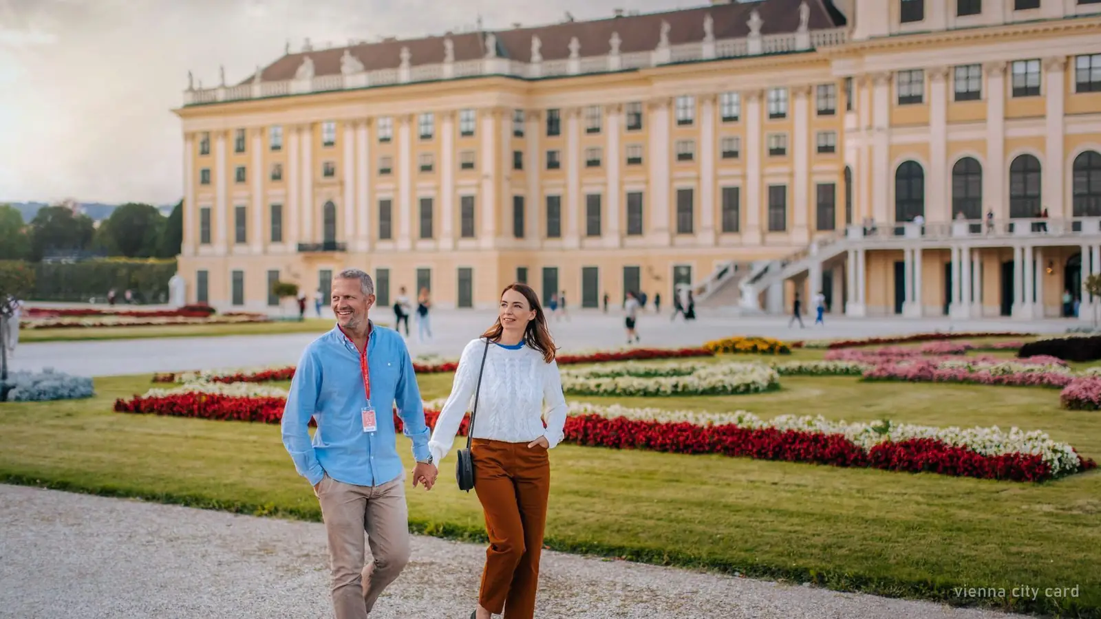 Two visitors walking in the gardens of Schoenbrunn Palace, Vienna — photo from the booking listing
