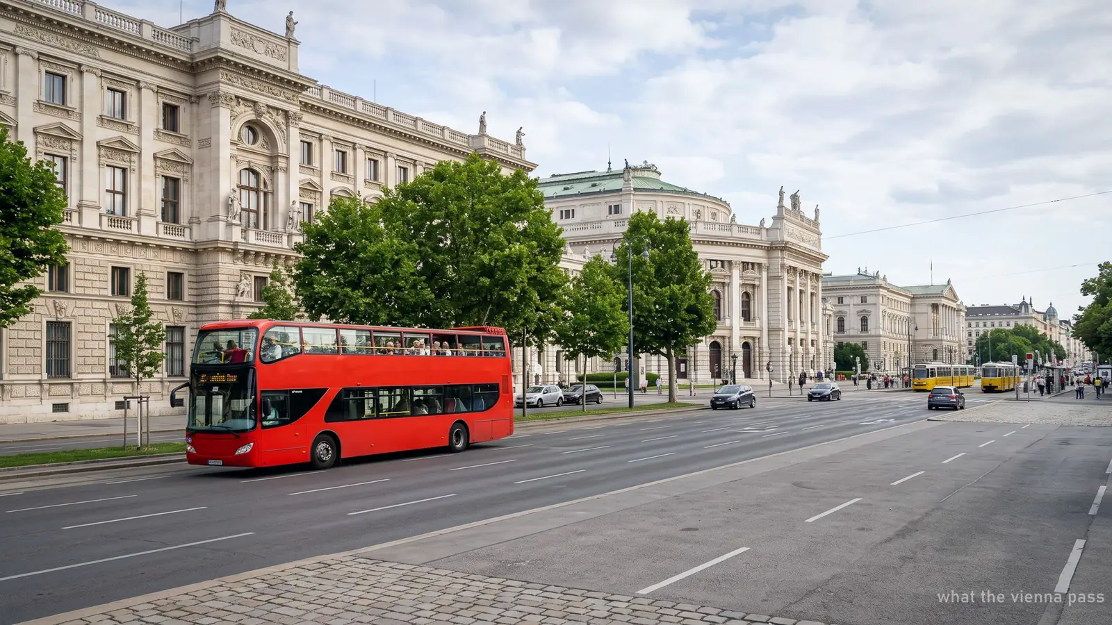 A red open-top sightseeing bus on Viennas Ringstrasse